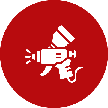 Spray gun icon on red circular background.